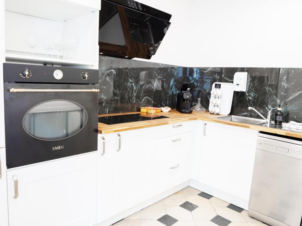 Kitchen or kitchenette, dishwasher, oven, stove, toaster