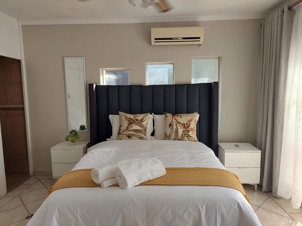 Photo of the whole room, Bedroom, towels, air conditioner