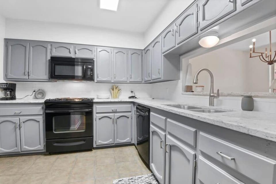 Kitchen or kitchenette, dishwasher, oven, stove
