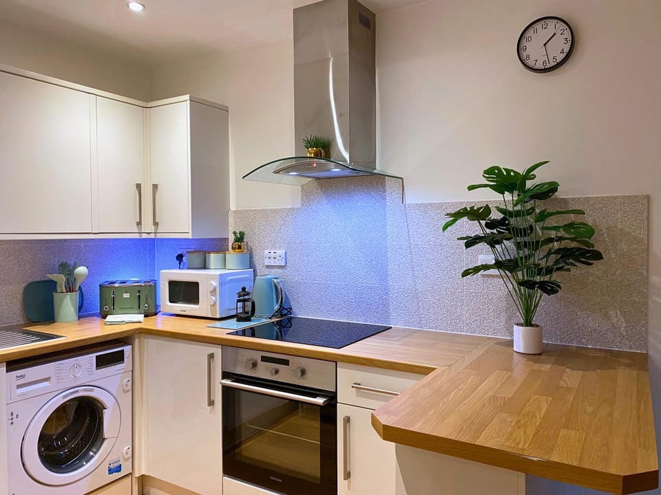 Kitchen or kitchenette, Dining area, dishwasher, oven, stove, toaster, washing machine, dryer