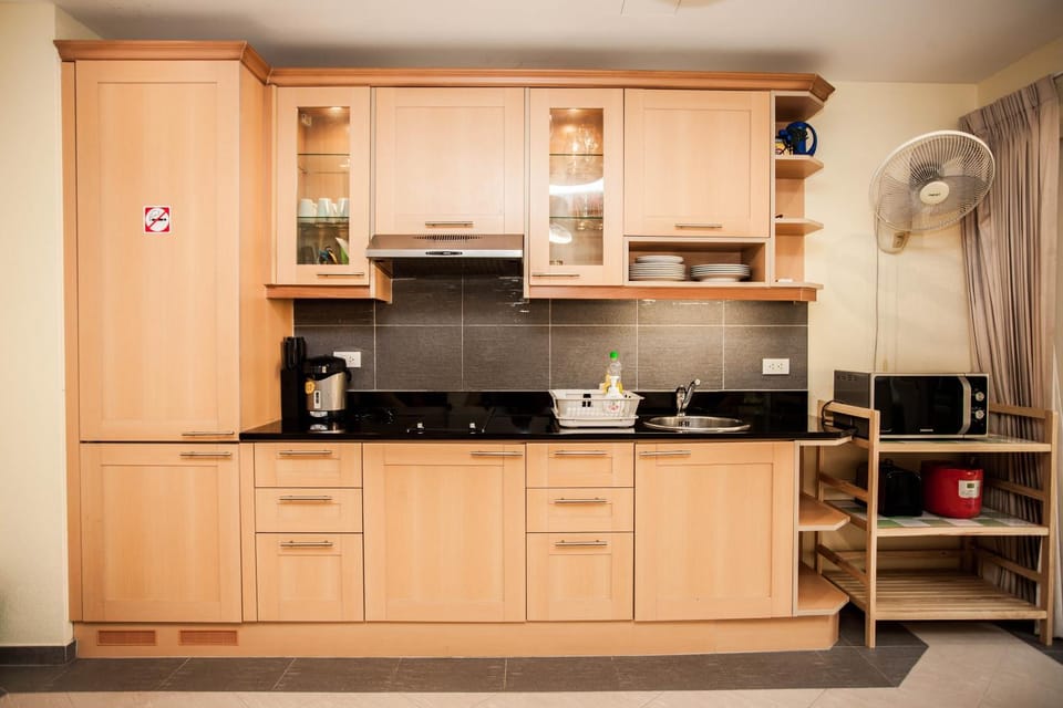 Kitchen or kitchenette, microwave, stove, toaster