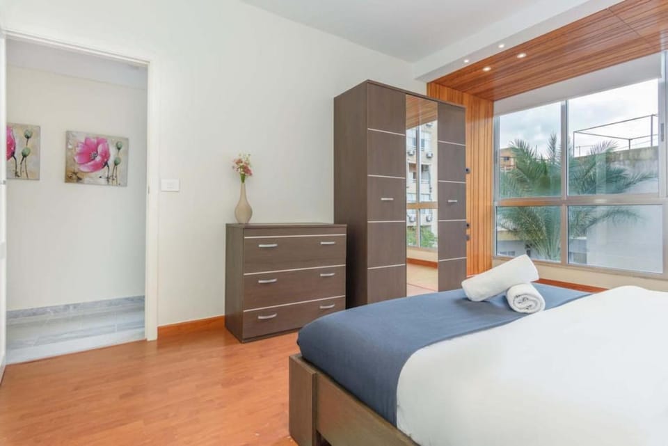 Bed, Bedroom, hair dryier, towels, wardrobe