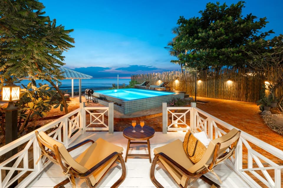 Property building, Seating area, Beach, Swimming pool, Sunset