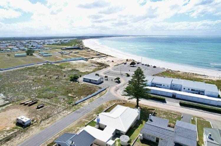 Day, Natural landscape, Bird's eye view, Beach, Text overlay, Text overlay, Sea view, Street view, Location