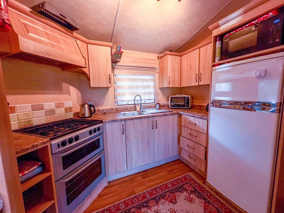 Kitchen or kitchenette, oven, stove, toaster