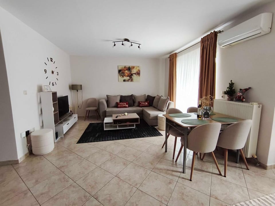 Living room, Seating area, Dining area, Logo/Certificate/Sign, air conditioner