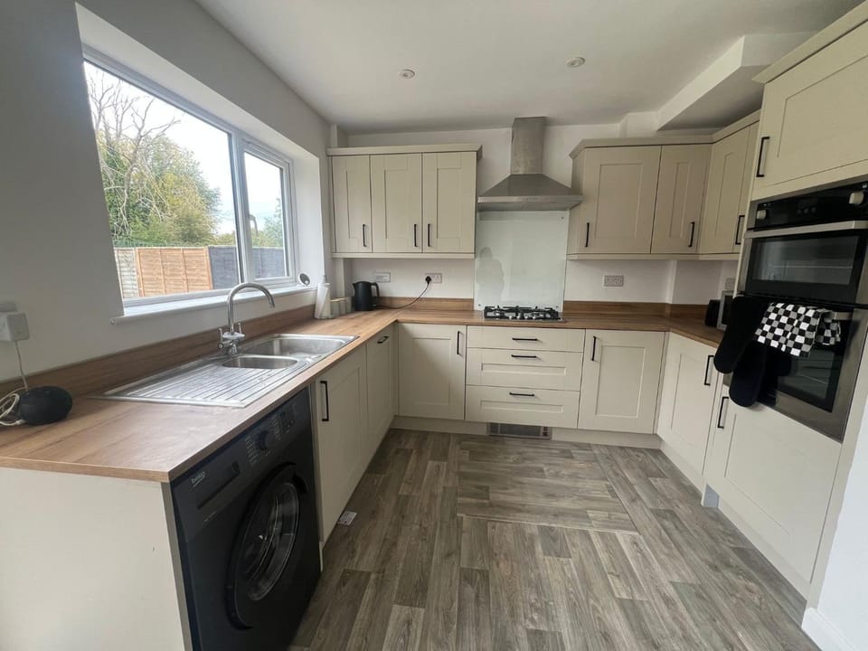 Kitchen or kitchenette, dishwasher, oven, stove, toaster