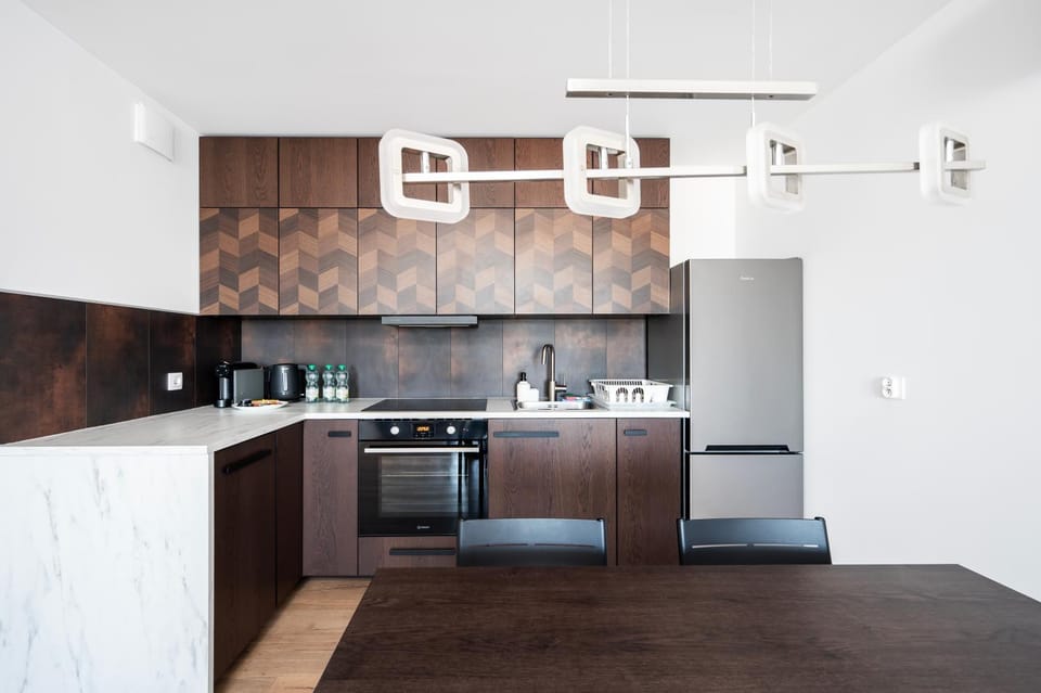 Kitchen or kitchenette, dishwasher, oven, stove