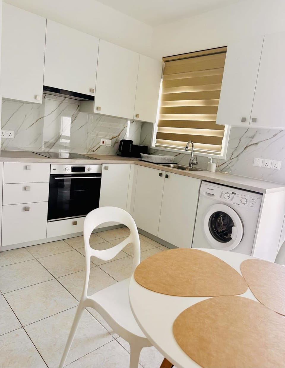 Kitchen or kitchenette, Dining area, oven, stove, washing machine, dryer