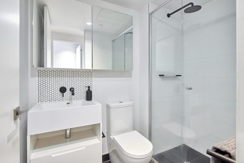 Shower, Toilet, Bathroom, hair dryier, towels