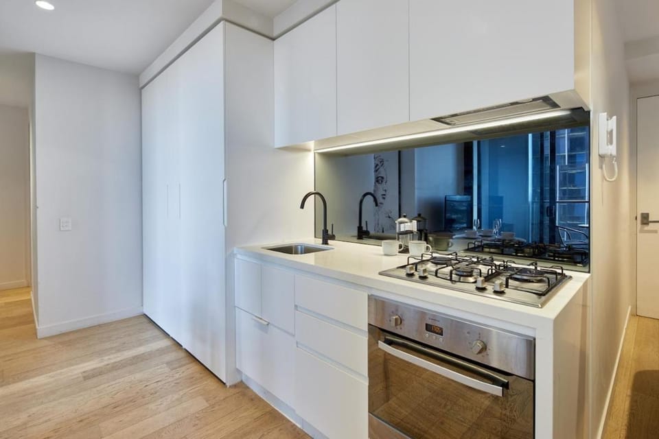 Kitchen or kitchenette, dishwasher, microwave, oven, stove, washing machine