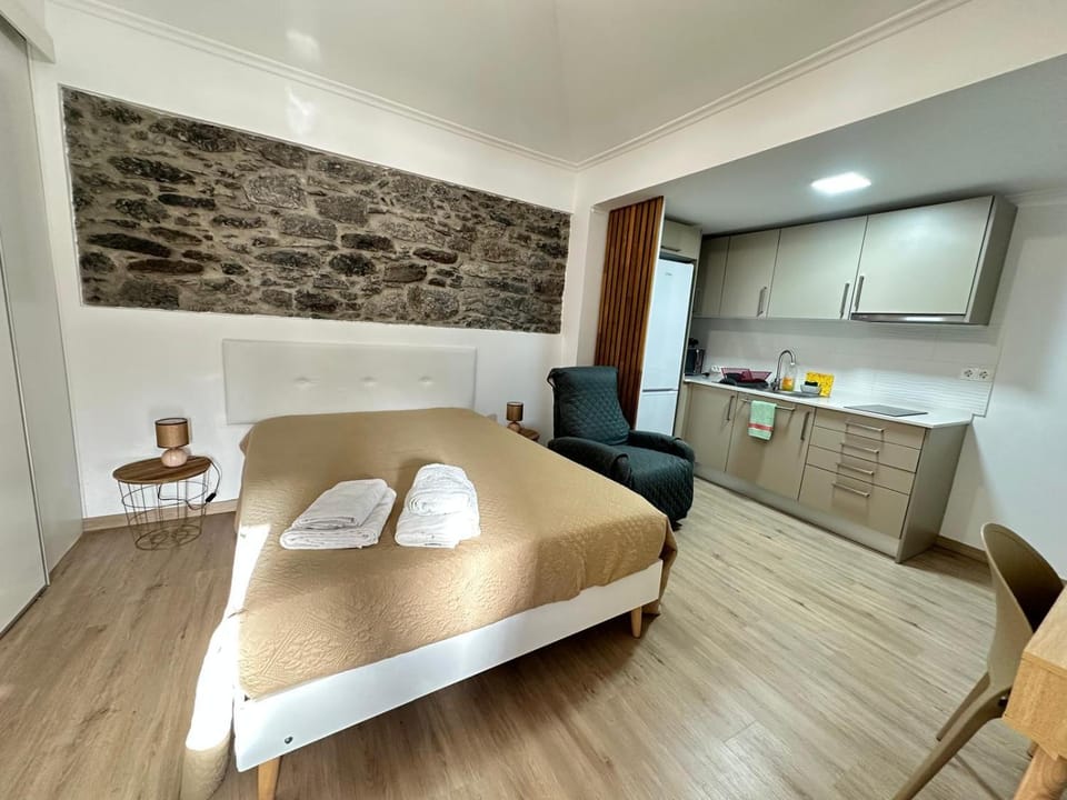 Bed, Kitchen or kitchenette, towels, kitchen