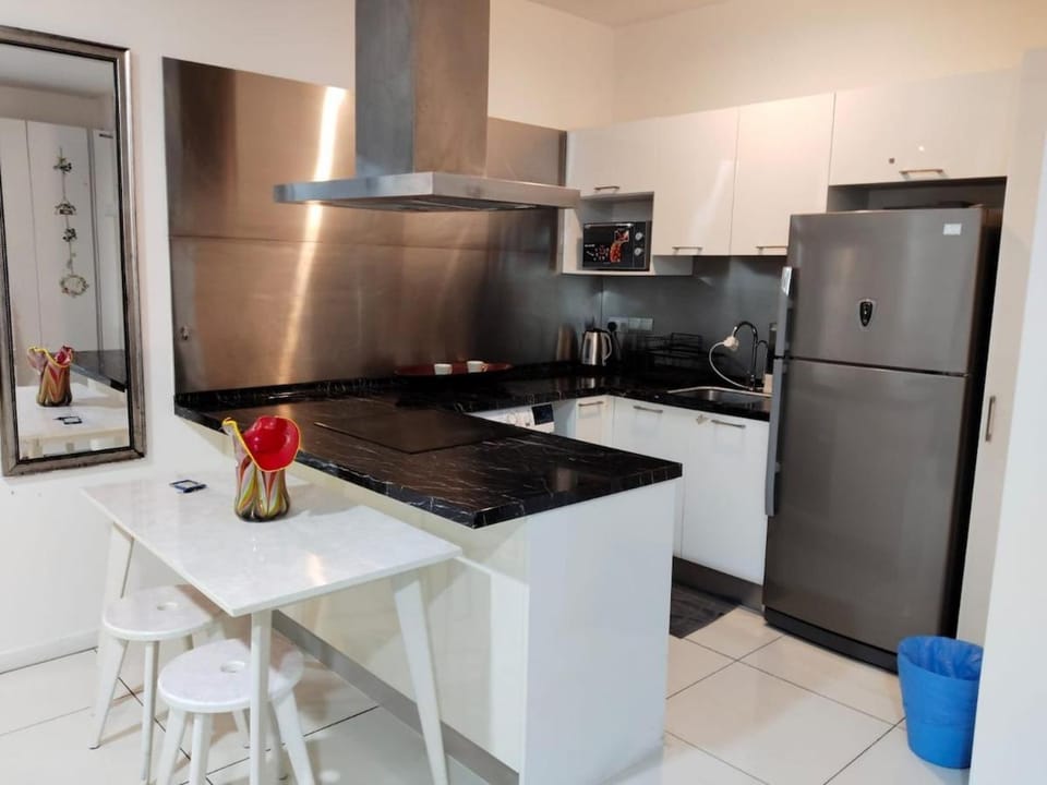 Kitchen or kitchenette, dishwasher, oven, stove