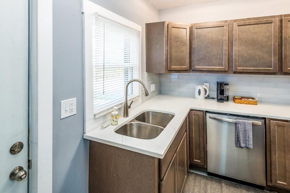 Kitchen or kitchenette, dishwasher, oven, stove