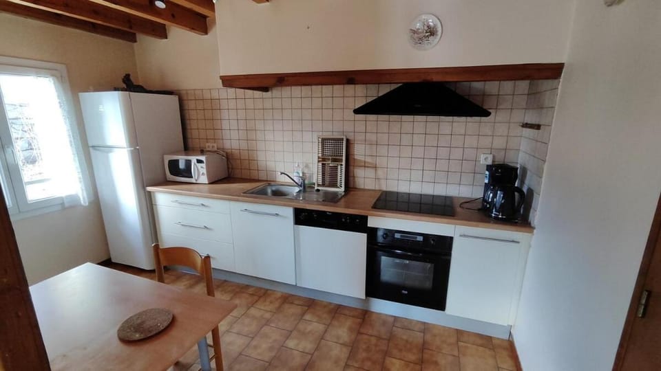 Kitchen or kitchenette, stove, toaster
