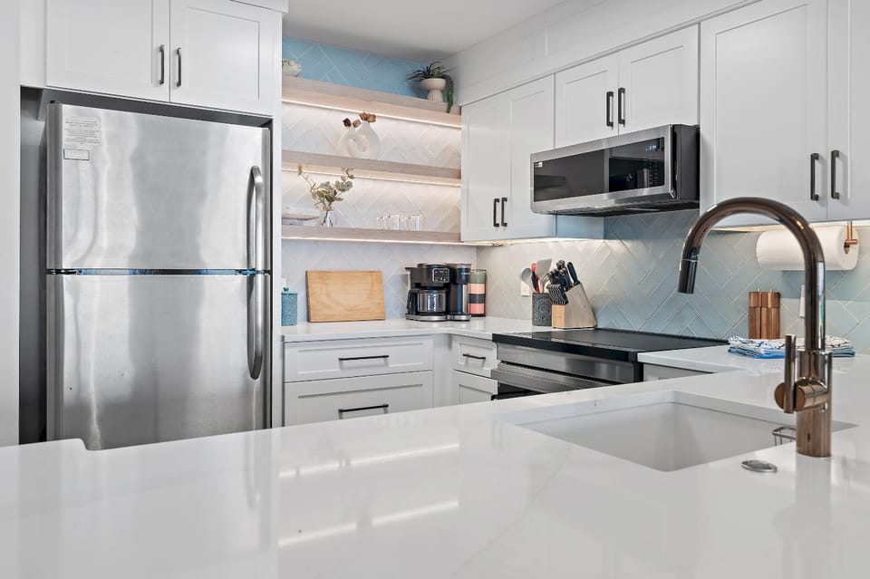 Kitchen or kitchenette, dishwasher, oven, stove