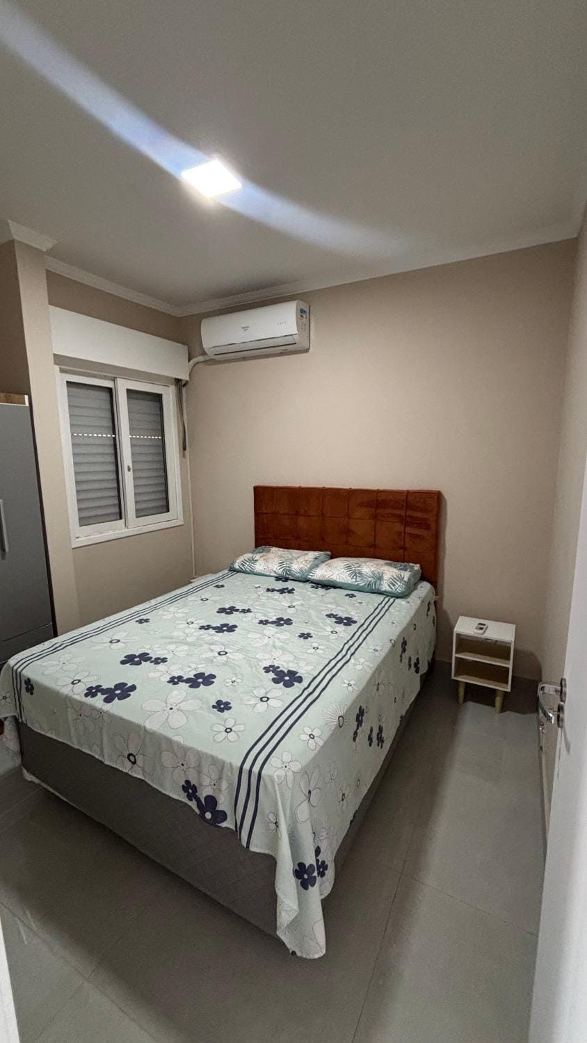 Aconchegante apartamento 2 dormitórios, sendo uma suíte com ar condicionado, Prédio com piscina Apartment in State of Rio Grande do Sul