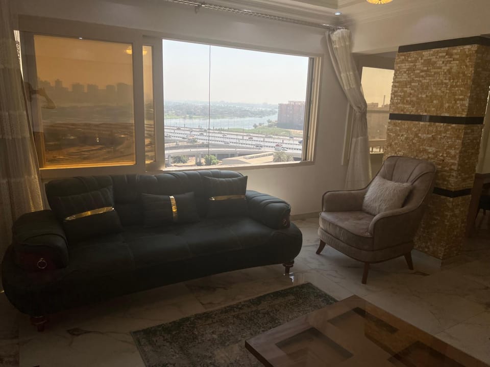 شقة فندقية بالبحر الاعظم كل الغرف مطله على النيل 3 غرف وحمامين ومطبخ ورسبشن Apartment in Cairo Governorate