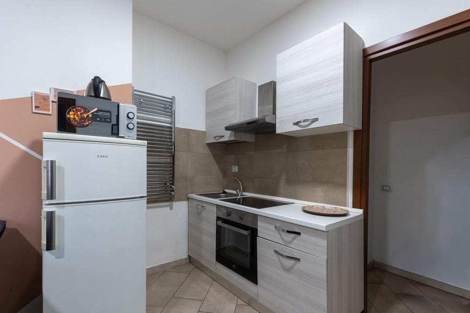 Kitchen or kitchenette, oven, stove