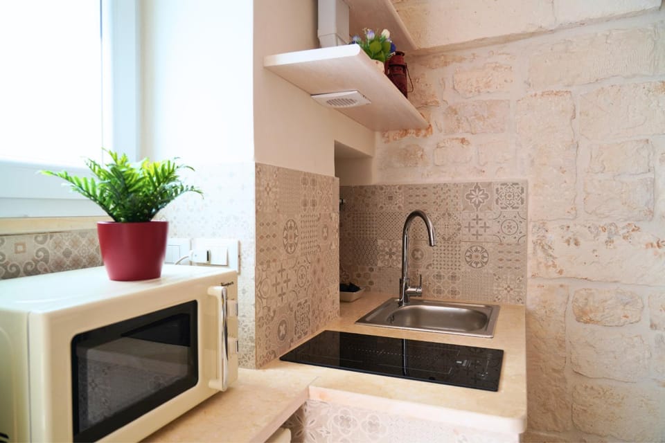 Kitchen or kitchenette, stove