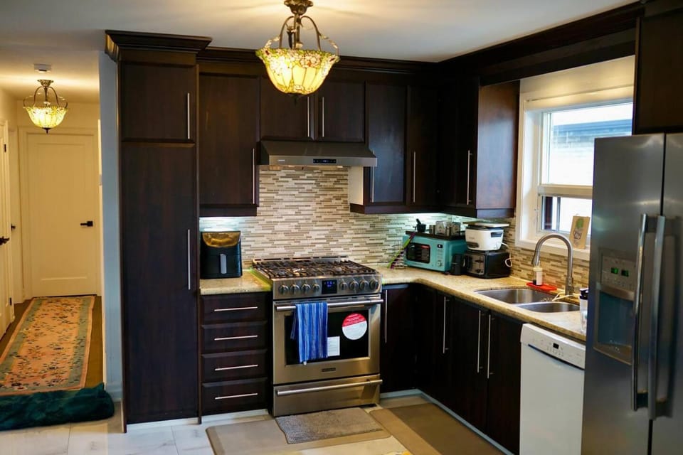 Kitchen or kitchenette, dishwasher, oven, stove