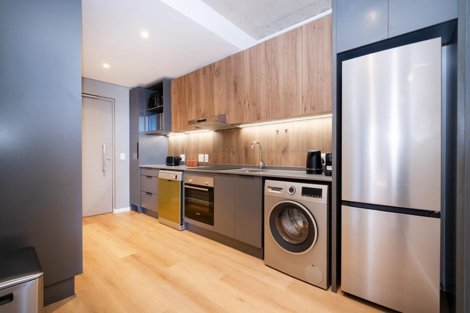 Kitchen or kitchenette, dishwasher, oven, stove, toaster, washing machine