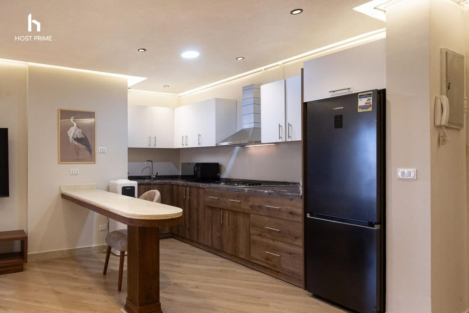 Kitchen or kitchenette, dishwasher, oven, stove