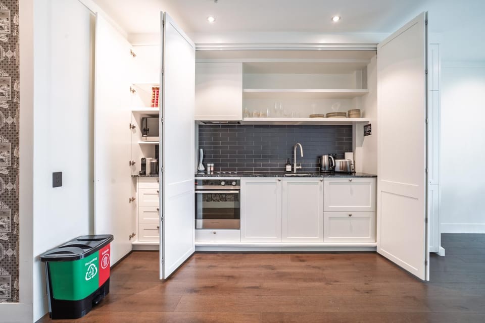 Kitchen or kitchenette, dishwasher, oven, stove