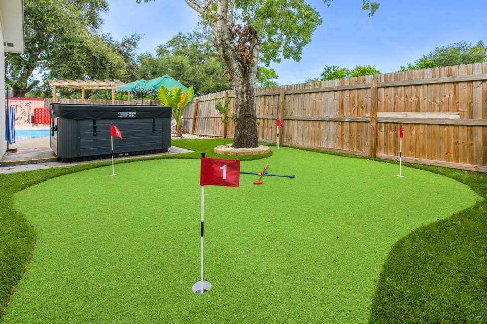 Resort Style Backyard Tiki Bar Pool Hot Tub House in Pinellas Park