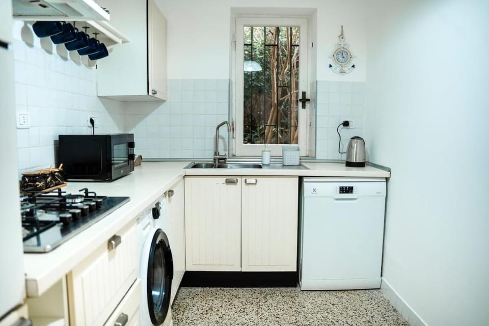 Kitchen or kitchenette, dishwasher, microwave, oven, stove, washing machine