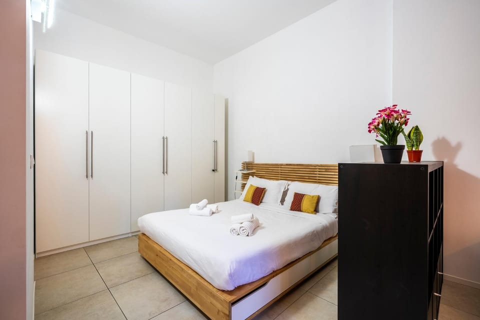 Bed, towels, wardrobe