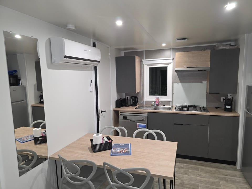 Dining area, stove, toaster, air conditioner
