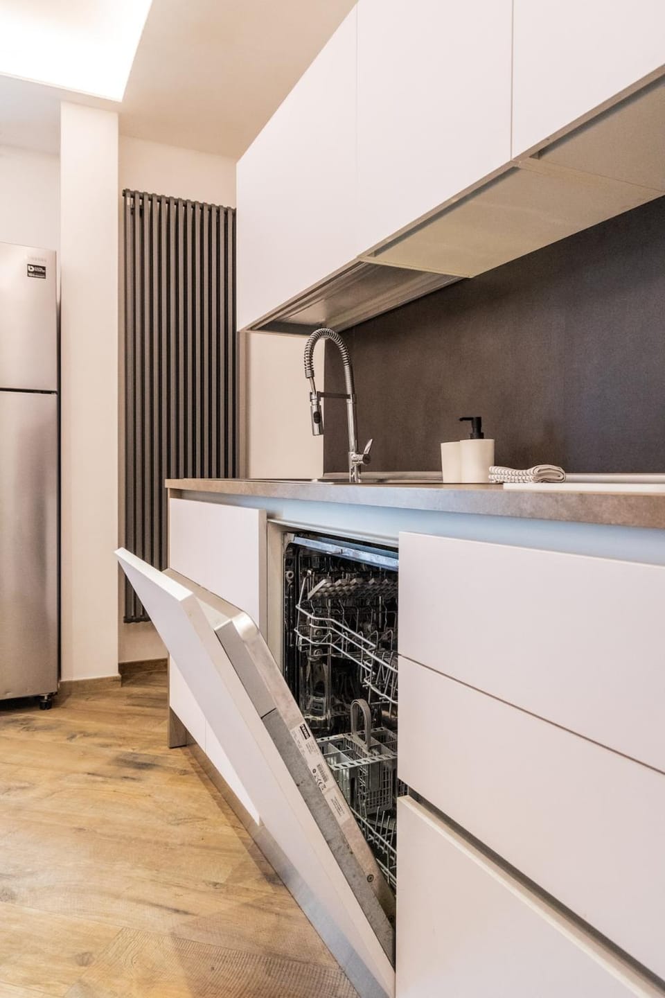 Kitchen or kitchenette, dishwasher, oven, stove