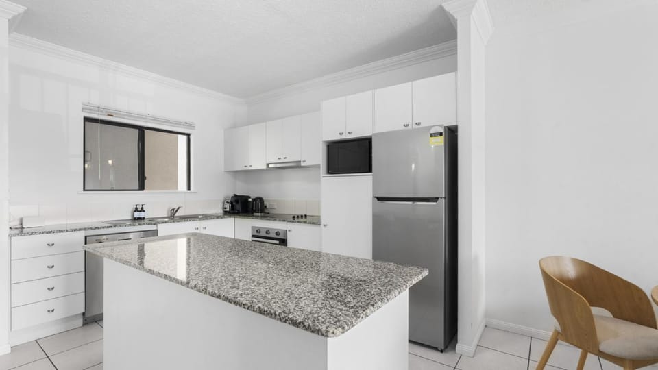 Kitchen or kitchenette, dishwasher, oven, stove