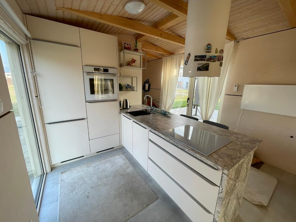 Kitchen or kitchenette, dishwasher, oven, stove
