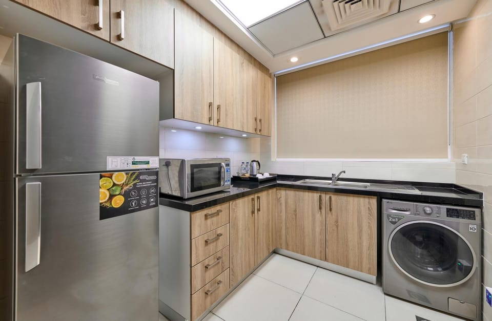 Kitchen or kitchenette, stove, washing machine
