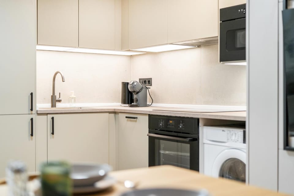 Kitchen or kitchenette, dishwasher, oven, stove, toaster, washing machine, dryer, kitchen