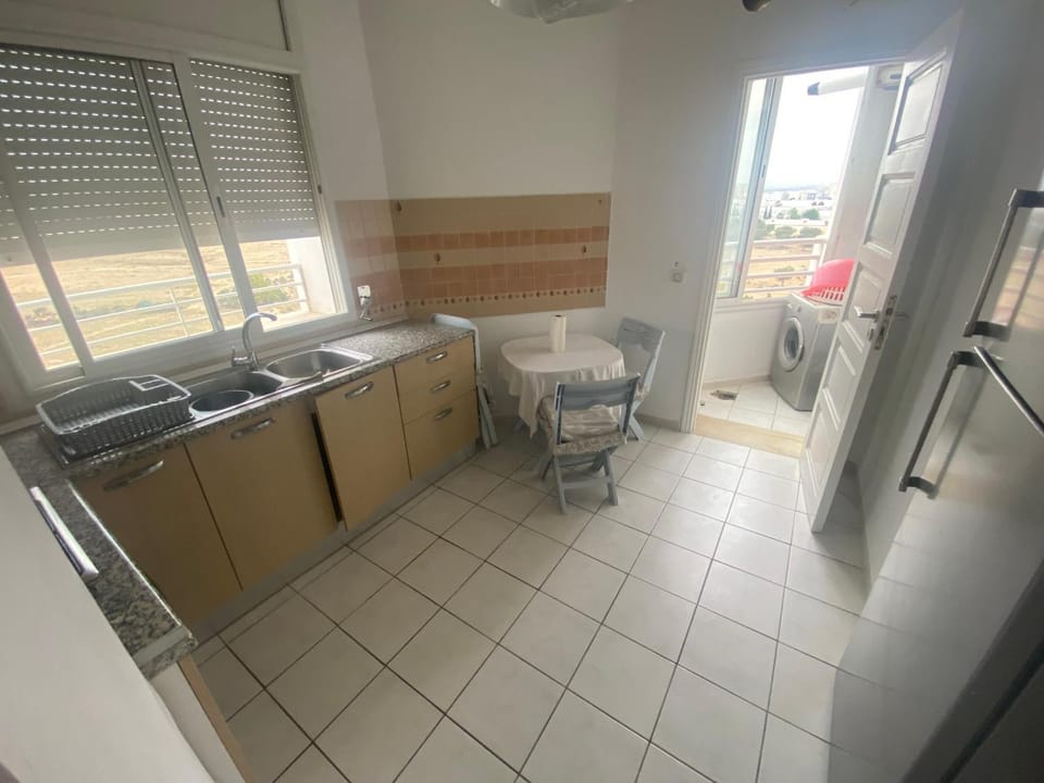 Kitchen or kitchenette, washing machine