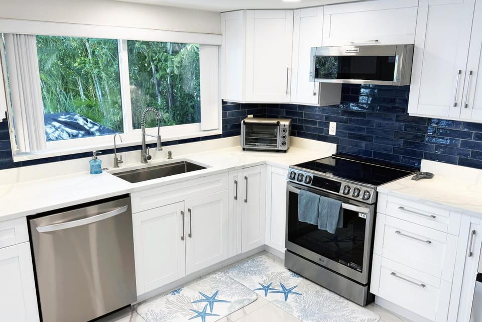Kitchen or kitchenette, dishwasher, oven, stove, toaster