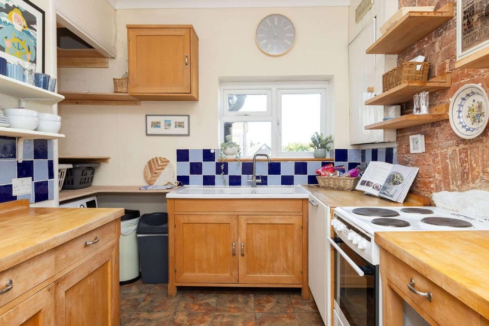Kitchen or kitchenette, dishwasher, oven, stove, toaster