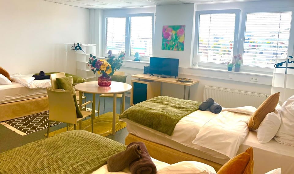Bed, TV and multimedia, Living room, Seating area, Bedroom