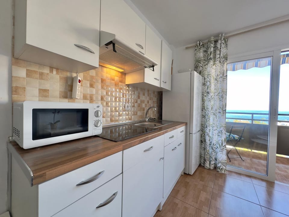 Kitchen or kitchenette, microwave