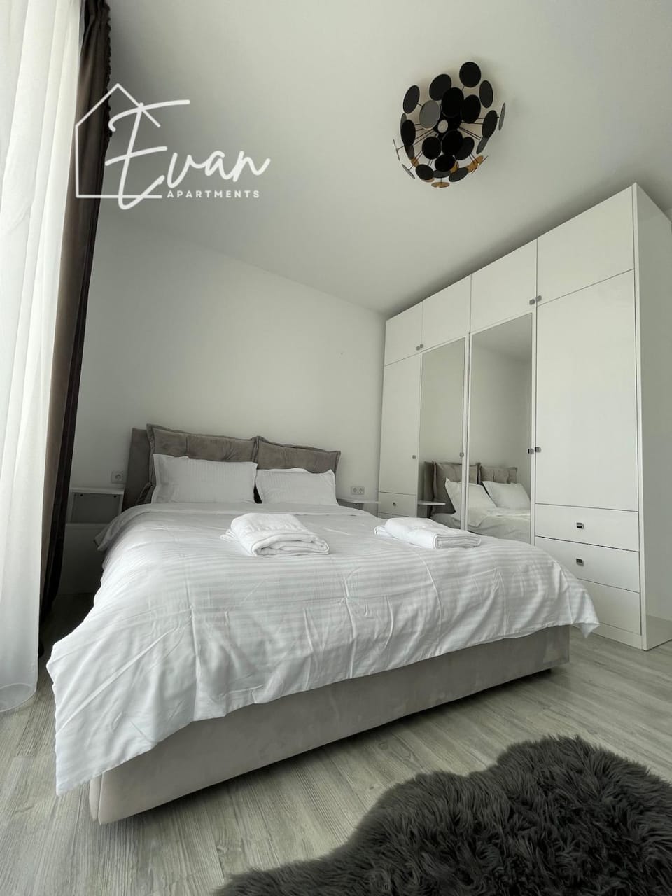 Bed, towels, wardrobe