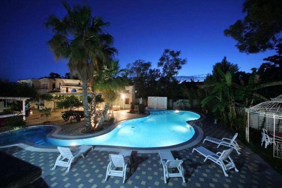 Property building, Patio, Night, Natural landscape, Garden, View (from property/room), Garden view, Pool view, Swimming pool, Swimming pool, sunbed
