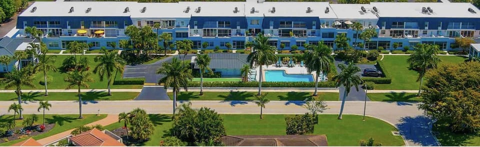 Belair Lane condo community pool managed by Sky Run Naples Apartment in Naples