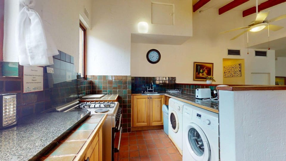 Kitchen or kitchenette, oven, stove, washing machine, dryer