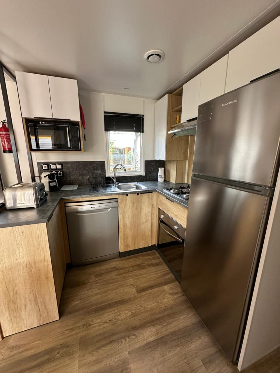 Kitchen or kitchenette, dishwasher, oven, stove, toaster