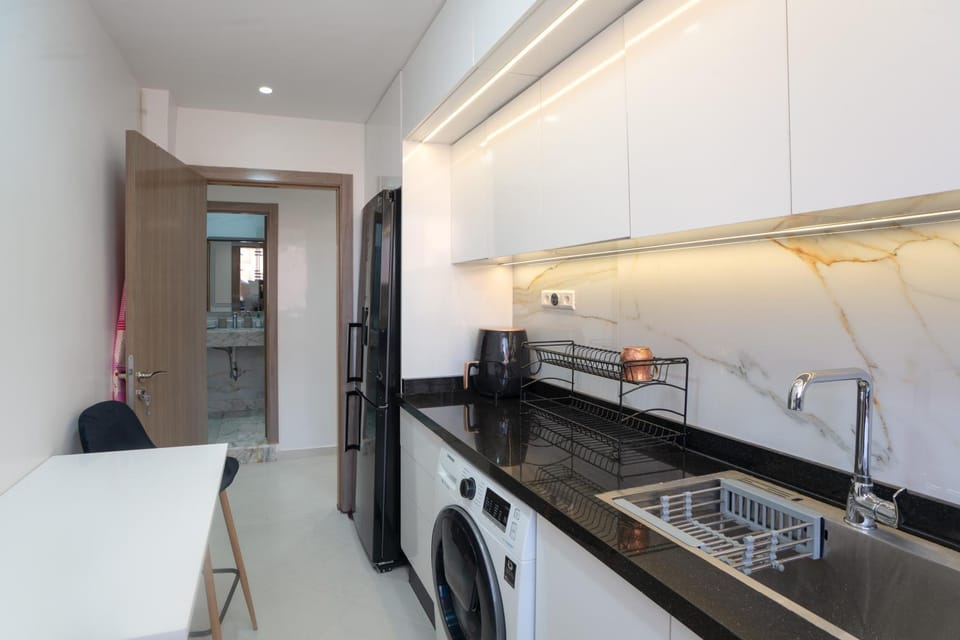 Kitchen or kitchenette, Dining area, oven, stove, washing machine