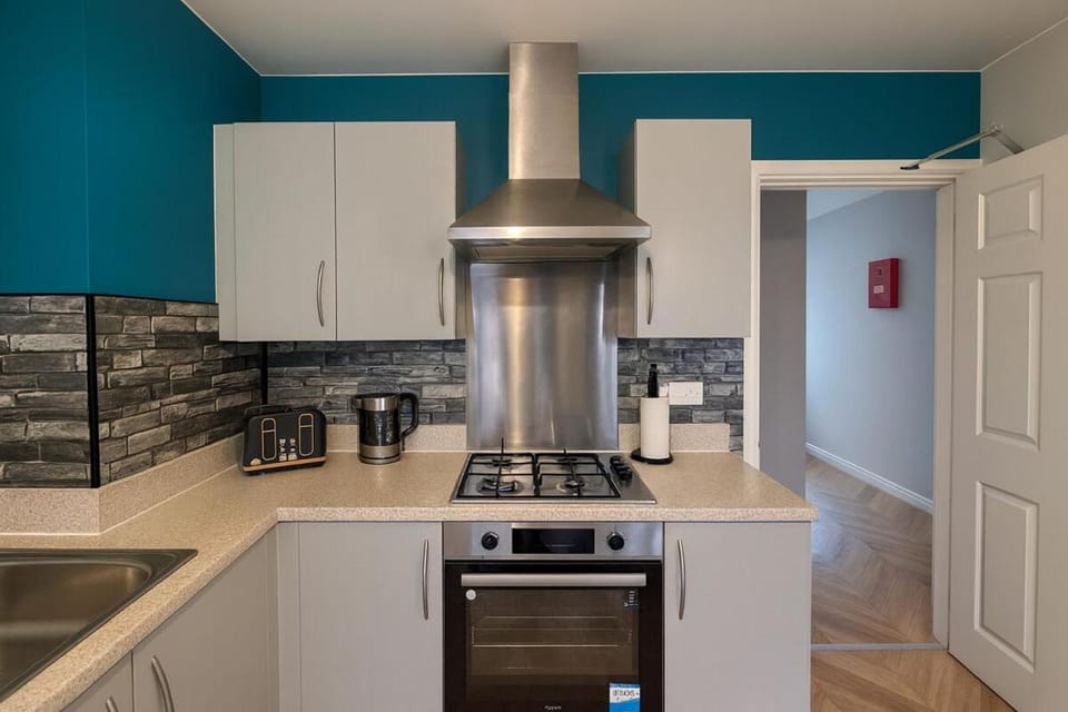 Kitchen or kitchenette, dishwasher, oven, stove, toaster