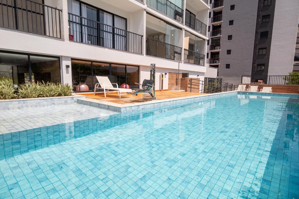 Property building, Day, Pool view, Swimming pool, sunbed